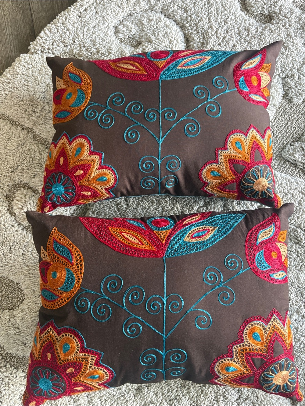 Pair Pier 1 throw pillows. Brown, orange, blue  red.